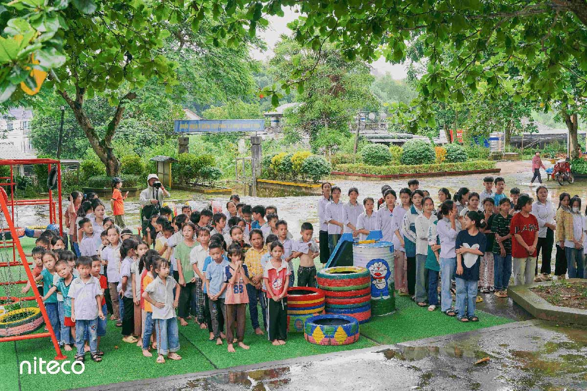 Children participating in outdoor environmental education and recycling activities