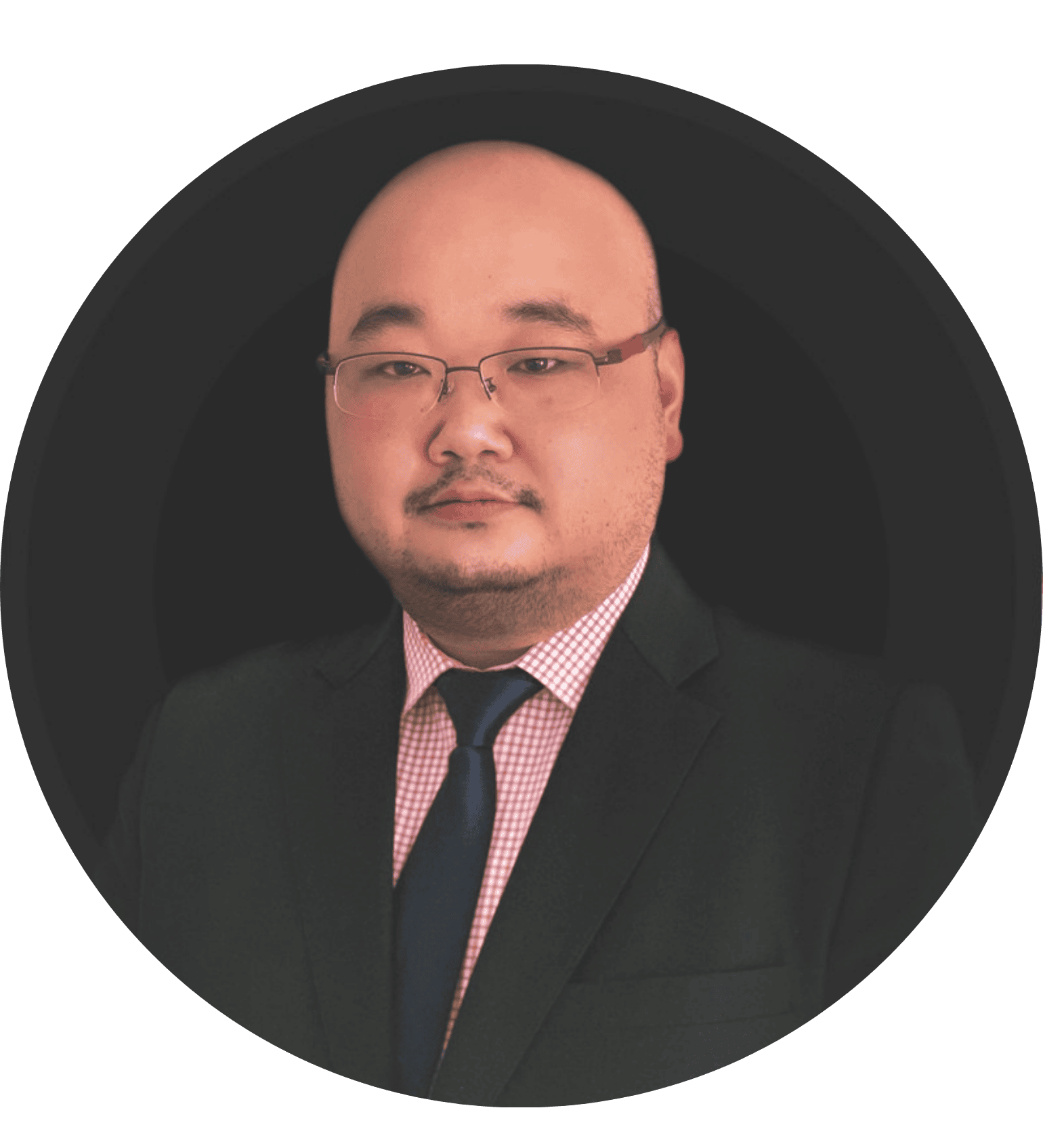 Professional headshot of a man in business attire with glasses and tie
