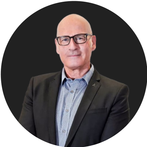 Bald man in glasses and blazer representing corporate leadership and expertise