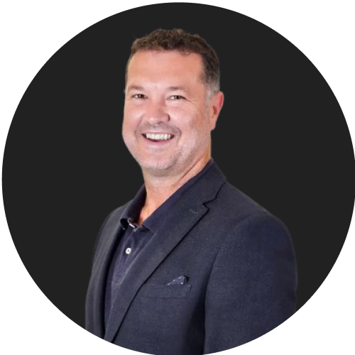 Smiling professional man in dark blazer representing business leadership and expertise