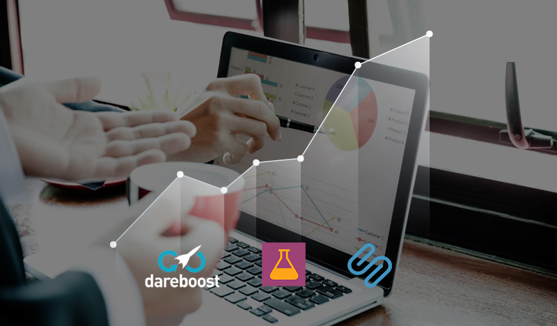 Hands analyzing sales data charts on laptop for business growth strategy