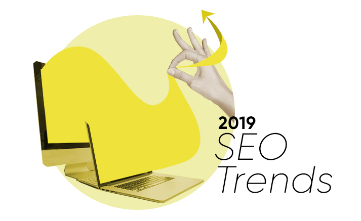 Hand gesture with laptop highlighting 2019 SEO Trends and growth arrow