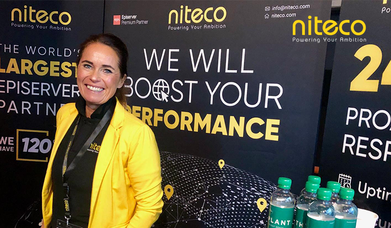 Niteco team member promoting performance boost and digital solutions at event