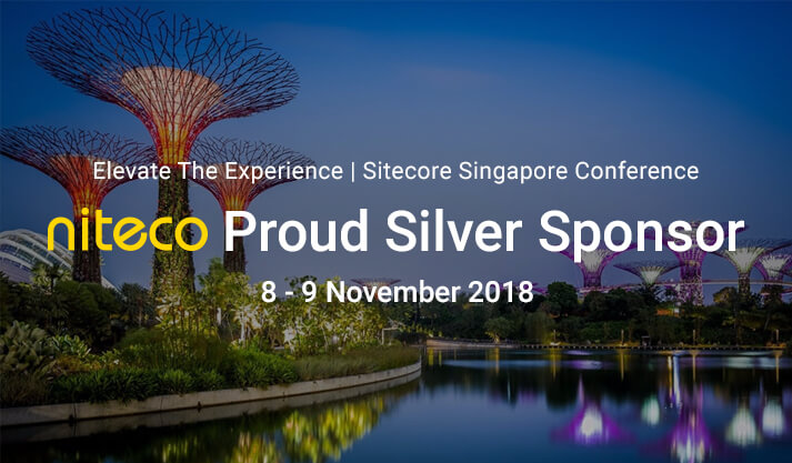 Gardens by the Bay at night with Niteco Silver Sponsor text for Sitecore Singapore.