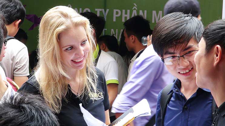 Friendly international teamwork with professionals discussing business ideas together